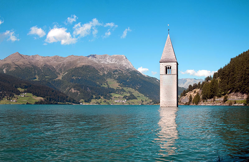 Glockenturm am Reschensee - Resia | Secret World Trip Planner