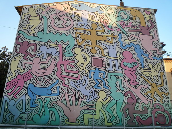 Tuttomondo múrmhaisiú ag Keith Haring - Pisa | Secret World Trip Planner
