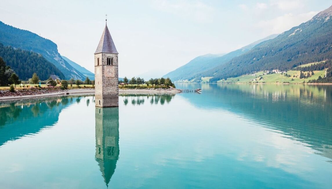 The Submerged Bell Tower, Located in Lake Resia - Resia | Secret World Trip Planner